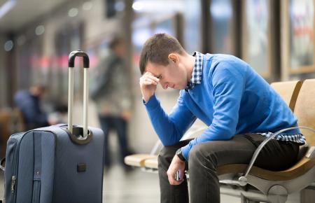 Man stressed waiting for luggage 