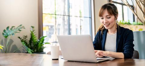 Woman on computer working remotely