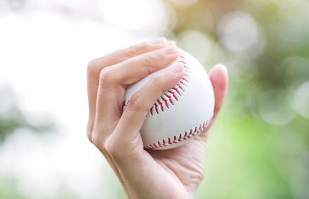 Person holding baseball