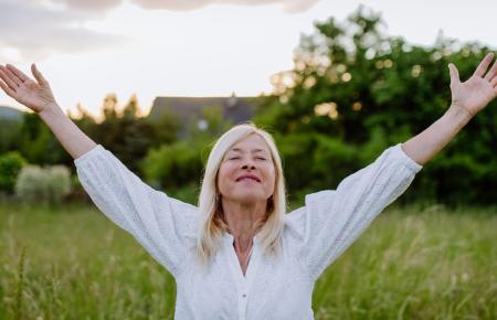 Woman with her arms raised 