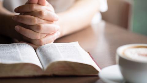 praying hot tea latte with bible 
