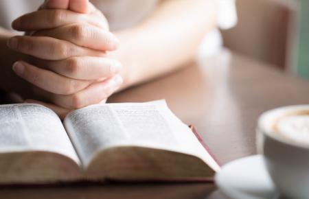 praying hot tea latte with bible 