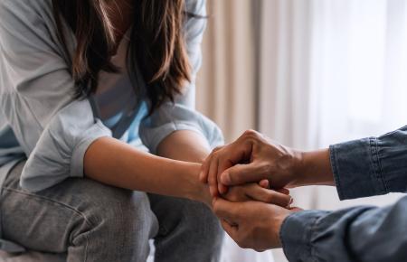 Holding hands out of worry