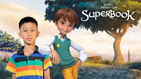 Day Era, a 10-year-old boy from Myanmar, stands facing the viewer. Chris from Superbook leans on Day Era's shoulder. The CBN Animation and Superbook logos are stacked in the upper right corner of the photo.