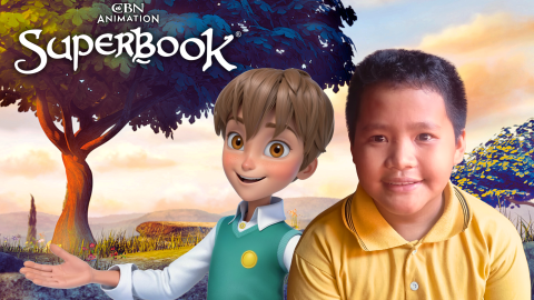 Alvaro, a 10-year-old boy in Indonesia, sits on the right side of frame and smiles. Chris from Superbook stands behind him to the left, smiling and reaching out. The CBN Animation and Superbook logos are stacked in the upper left corner.