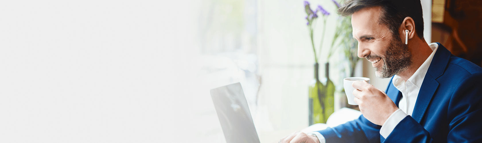 Man Listening on Laptop