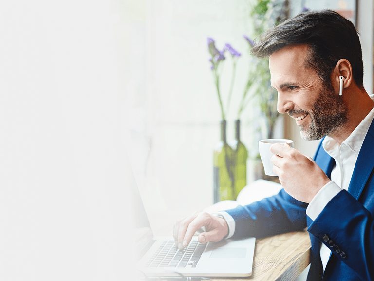 Man Listening on Laptop
